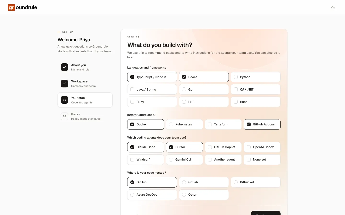 Step 3 of onboarding: languages, infrastructure, coding agents and code host, with TypeScript, React, Docker, GitHub Actions, Claude Code, Cursor and GitHub selected.