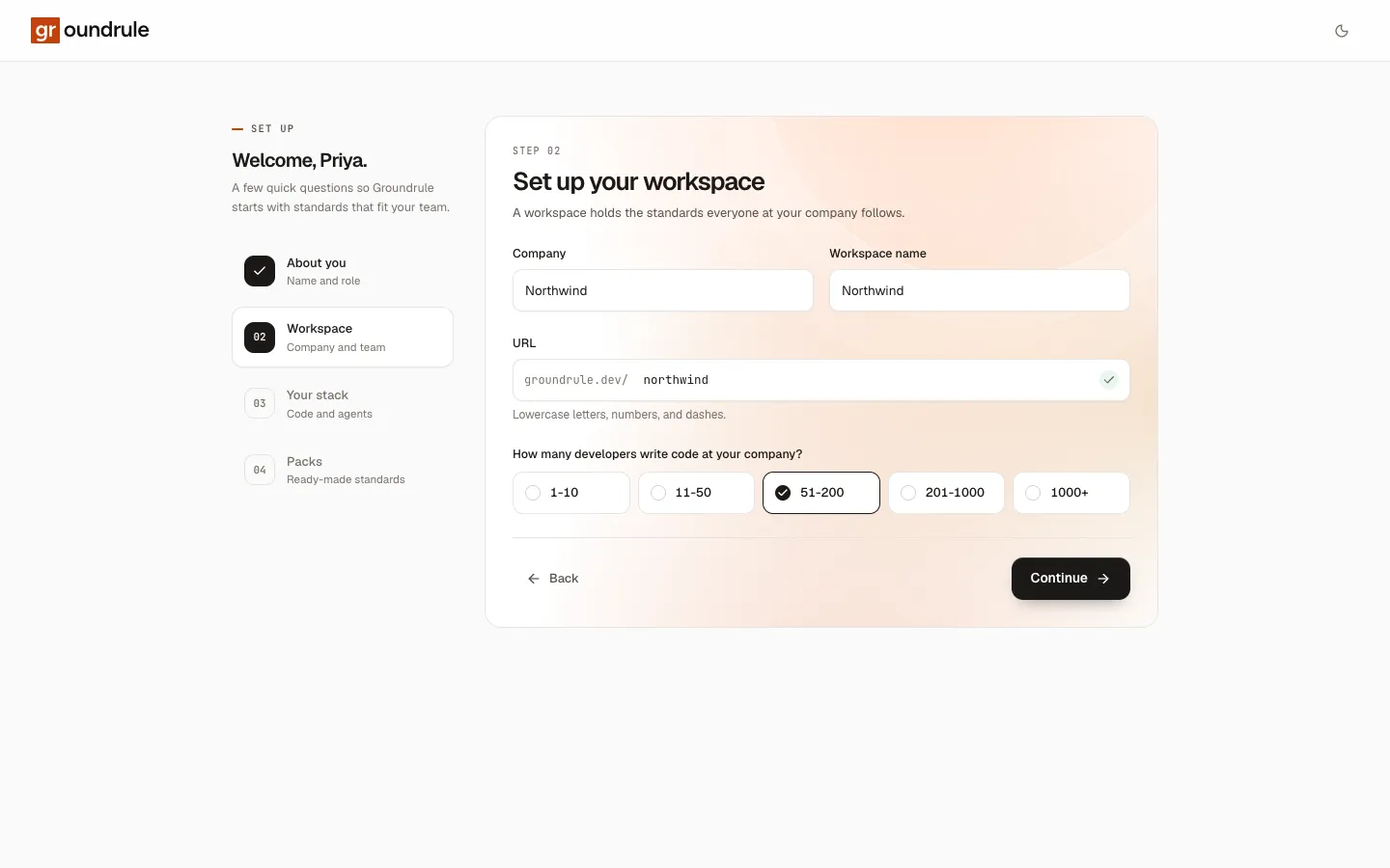 Step 2 of onboarding: Company, Workspace name, the URL field with an availability tick, and the developer-count choices.